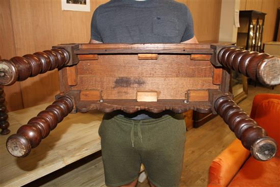 A pair of small late Victorian carved oak hall benches, W.65cm D.25cm H.43cm